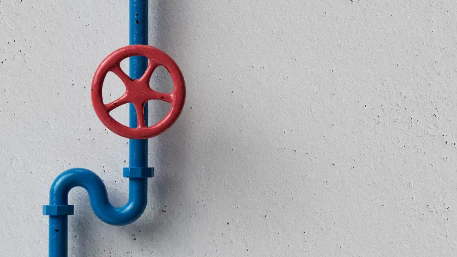 A simple blue pipe with a red valve on a white background.